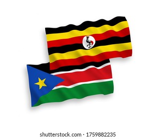 National vector fabric wave flags of Republic of South Sudan and Uganda isolated on white background. 1 to 2 proportion.