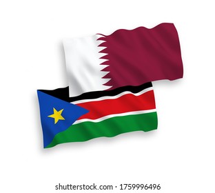 National vector fabric wave flags of Republic of South Sudan and Qatar isolated on white background. 1 to 2 proportion.