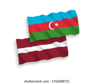 National vector fabric wave flags of Latvia and Azerbaijan isolated on white background. 1 to 2 proportion.