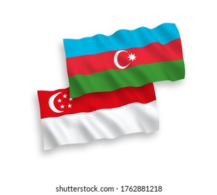 National vector fabric wave flags of Azerbaijan and Singapore isolated on white background. 1 to 2 proportion.