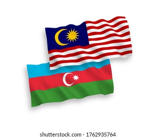 National vector fabric wave flags of Azerbaijan and Malaysia isolated on white background. 1 to 2 proportion.