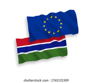 National vector fabric wave flags of European Union and Republic of Gambia isolated on white background. 1 to 2 proportion.