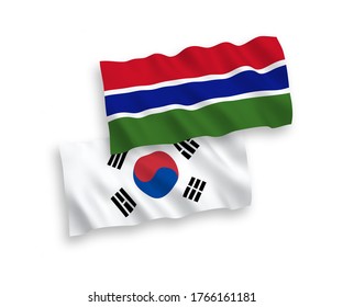 National vector fabric wave flags of South Korea and Republic of Gambia isolated on white background. 1 to 2 proportion.
