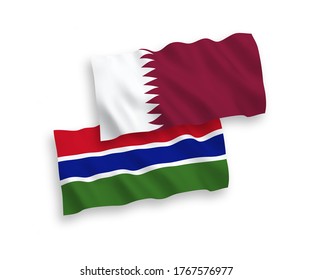 National vector fabric wave flags of Republic of Gambia and Qatar isolated on white background. 1 to 2 proportion.
