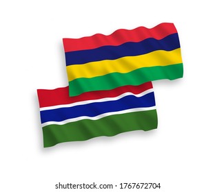 National vector fabric wave flags of Republic of Gambia and Republic of Mauritius isolated on white background. 1 to 2 proportion.