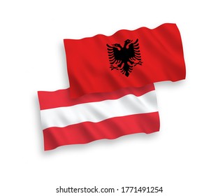 National vector fabric wave flags of Austria and Albania isolated on white background. 1 to 2 proportion.
