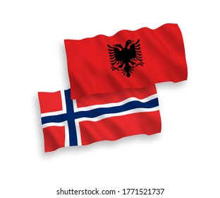 National vector fabric wave flags of Norway and Albania isolated on white background. 1 to 2 proportion.