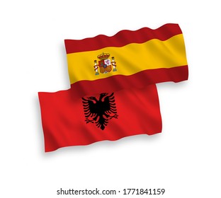 National vector fabric wave flags of Albania and Spain isolated on white background. 1 to 2 proportion.