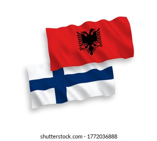 National vector fabric wave flags of Finland and Albania isolated on white background. 1 to 2 proportion.