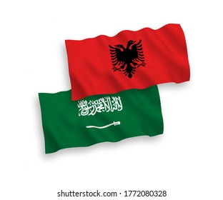 National vector fabric wave flags of Saudi Arabia and Albania isolated on white background. 1 to 2 proportion.