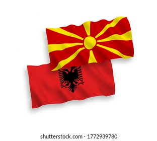 National vector fabric wave flags of Albania and North Macedonia isolated on white background. 1 to 2 proportion.