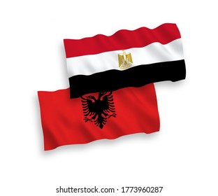 National vector fabric wave flags of Albania and Egypt isolated on white background. 1 to 2 proportion.