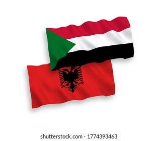 National vector fabric wave flags of Albania and Sudan isolated on white background. 1 to 2 proportion.