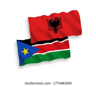 National vector fabric wave flags of Albania and Republic of South Sudan isolated on white background. 1 to 2 proportion.
