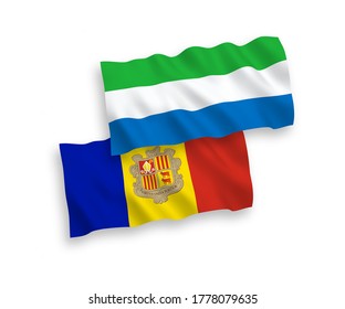 National vector fabric wave flags of Andorra and Sierra Leone isolated on white background. 1 to 2 proportion.