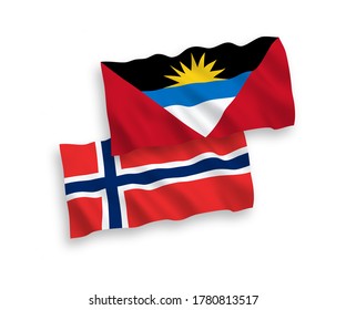 National vector fabric wave flags of Norway and Antigua and Barbuda isolated on white background. 1 to 2 proportion.