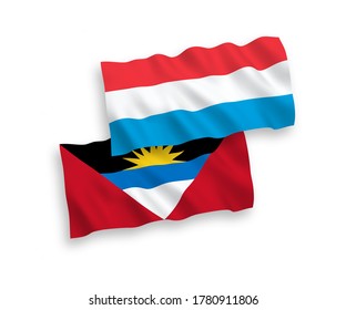 Nationale Vektor-Wellen-Flaggen von Antigua und Barbuda und Luxemburg einzeln auf weißem Hintergrund. 1 bis 2 %.