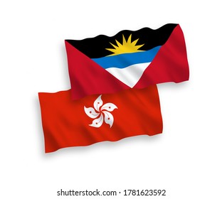 National vector fabric wave flags of Antigua and Barbuda and Hong Kong isolated on white background. 1 to 2 proportion.