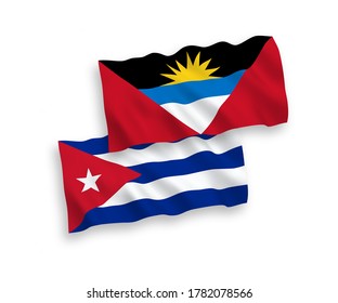 National vector fabric wave flags of Antigua and Barbuda and Cuba isolated on white background. 1 to 2 proportion.