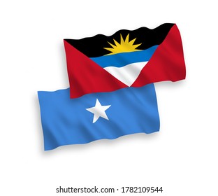 National vector fabric wave flags of Antigua and Barbuda and Somalia isolated on white background. 1 to 2 proportion.