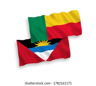National vector fabric wave flags of Antigua and Barbuda and Benin isolated on white background. 1 to 2 proportion.