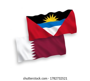National vector fabric wave flags of Antigua and Barbuda and Qatar isolated on white background. 1 to 2 proportion.