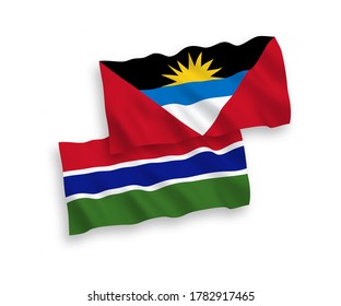National vector fabric wave flags of Antigua and Barbuda and Republic of Gambia isolated on white background. 1 to 2 proportion.