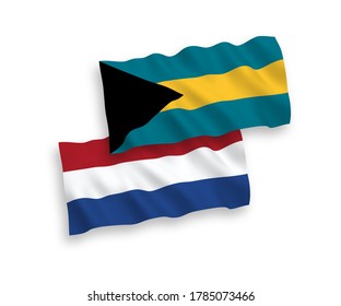 National vector fabric wave flags of Commonwealth of The Bahamas and Netherlands isolated on white background. 1 to 2 proportion.