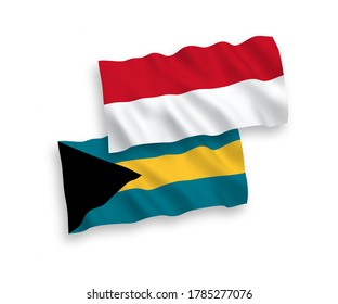 Banderas de ondulación de tela vectorial nacional de Indonesia y del Commonwealth de las Bahamas aisladas de fondo blanco. de 1 a 2.