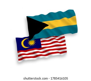 National vector fabric wave flags of Commonwealth of The Bahamas and Malaysia isolated on white background. 1 to 2 proportion.