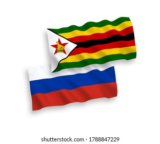 National vector fabric wave flags of Zimbabwe and Russia isolated on white background. 1 to 2 proportion.