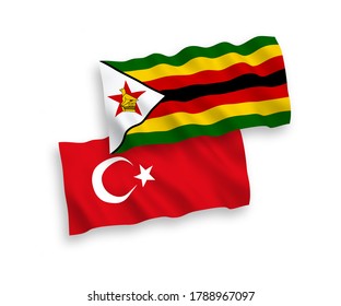 National vector fabric wave flags of Turkey and Zimbabwe isolated on white background. 1 to 2 proportion.