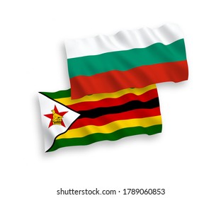 National vector fabric wave flags of Bulgaria and Zimbabwe isolated on white background. 1 to 2 proportion.