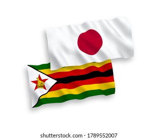 Banderas de olas de tela vectorial nacional de Japón y Zimbabue aisladas en fondo blanco. de 1 a 2.