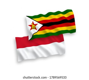 Banderas de olas de tela vectorial nacional de Indonesia y Zimbabue aisladas en fondo blanco. de 1 a 2.