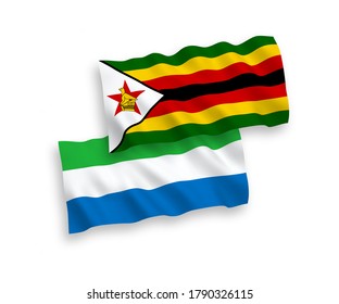 National vector fabric wave flags of Zimbabwe and Sierra Leone isolated on white background. 1 to 2 proportion.