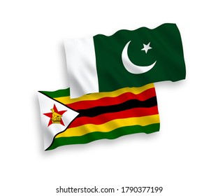 Banderas de olas de tela vectorial nacional de Zimbabue y Pakistán aisladas en fondo blanco. de 1 a 2.