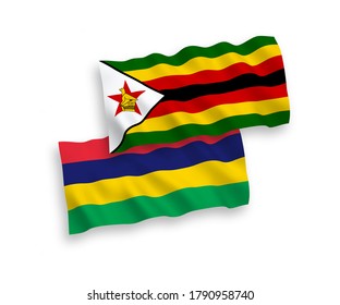National vector fabric wave flags of Zimbabwe and Republic of Mauritius isolated on white background. 1 to 2 proportion.
