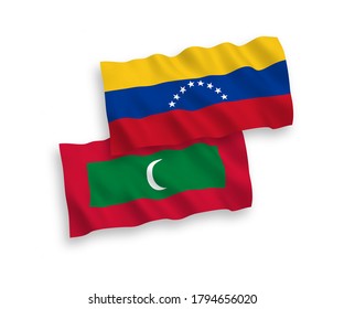 National vector fabric wave flags of Venezuela and Maldives isolated on white background. 1 to 2 proportion.