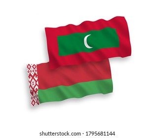 National vector fabric wave flags of Maldives and Belarus isolated on white background. 1 to 2 proportion.
