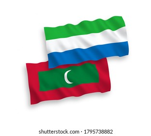 National vector fabric wave flags of Maldives and Sierra Leone isolated on white background. 1 to 2 proportion.