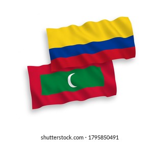 National vector fabric wave flags of Maldives and Colombia isolated on white background. 1 to 2 proportion.