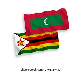National vector fabric wave flags of Maldives and Zimbabwe isolated on white background. 1 to 2 proportion.