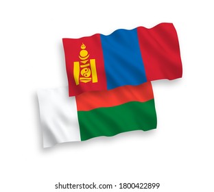 National vector fabric wave flags of Mongolia and Madagascar isolated on white background. 1 to 2 proportion.