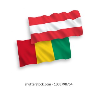 National vector fabric wave flags of Austria and Guinea isolated on white background. 1 to 2 proportion.