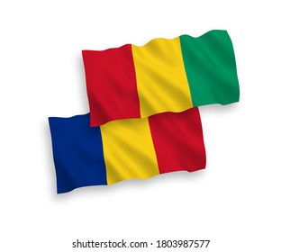 National vector fabric wave flags of Romania and Guinea isolated on white background. 1 to 2 proportion.