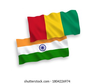 National vector fabric wave flags of India and Guinea isolated on white background. 1 to 2 proportion.