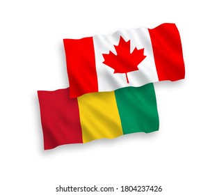 National vector fabric wave flags of Canada and Guinea isolated on white background. 1 to 2 proportion.