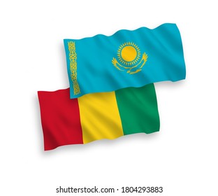 National vector fabric wave flags of Kazakhstan and Guinea isolated on white background. 1 to 2 proportion.