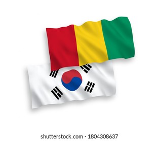 National vector fabric wave flags of South Korea and Guinea isolated on white background. 1 to 2 proportion.